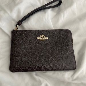 Coach small wallet with wrist band.
